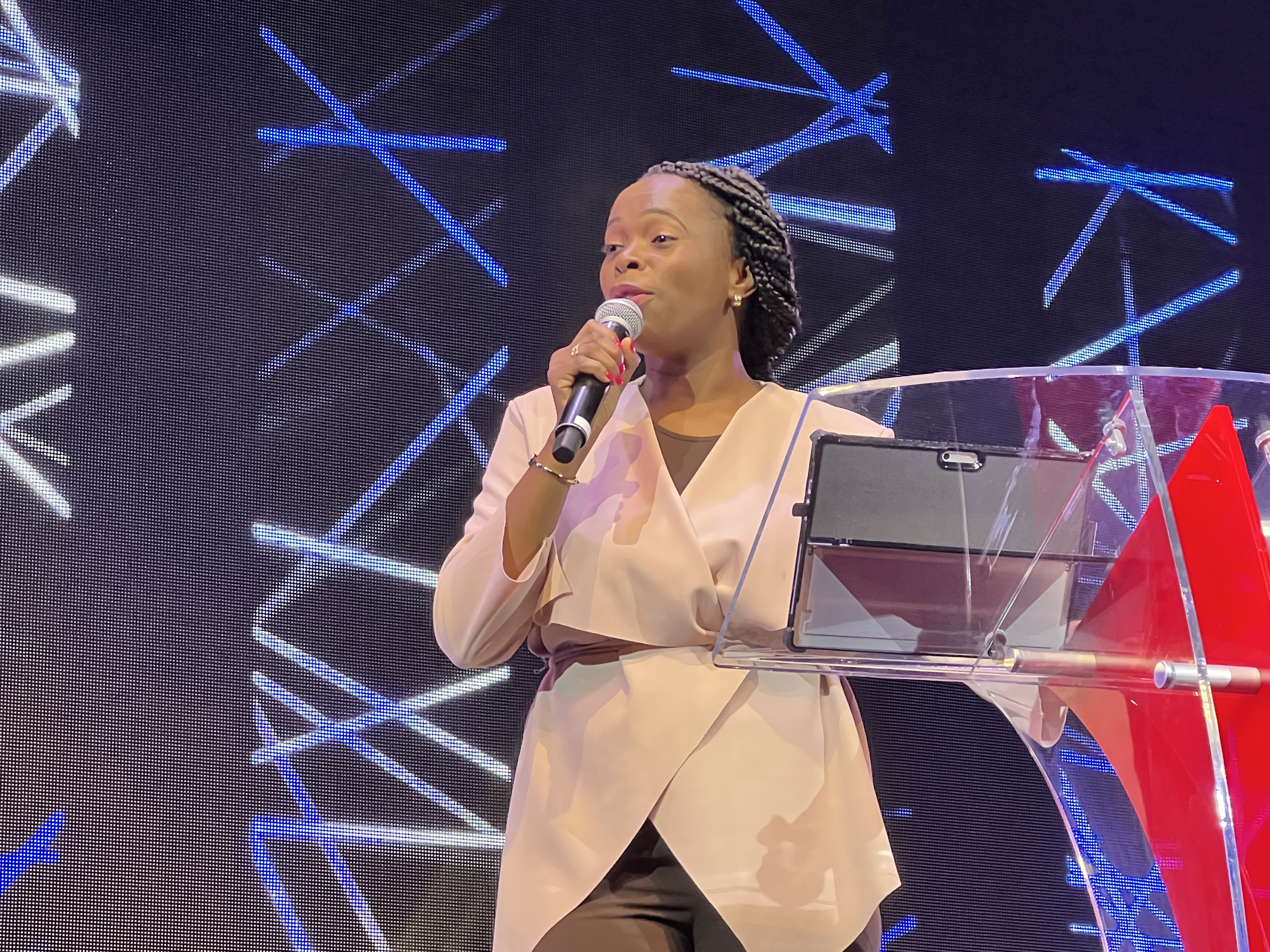 Toyin Adefemi speaking on stage